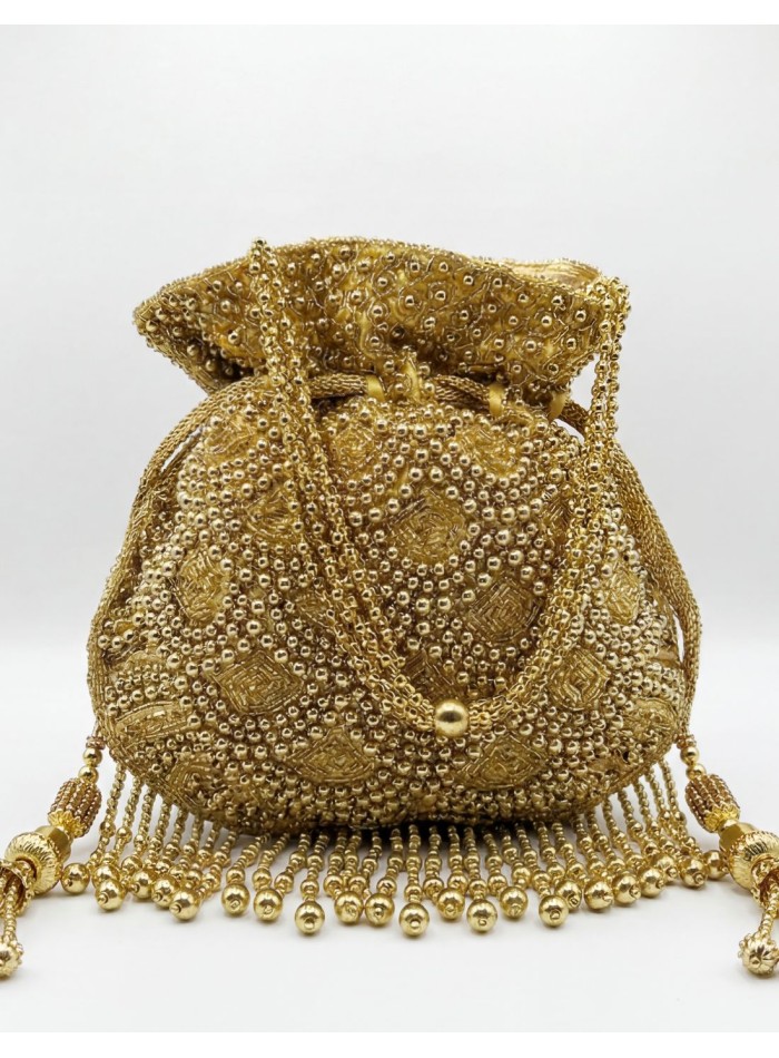 Bolso bombonera dorada con abalorios y flecos...