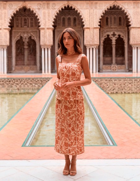 Terracotta colored printed guest dress with flowers