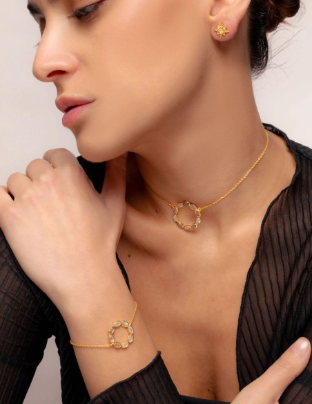Golden bracelet with circle with stones