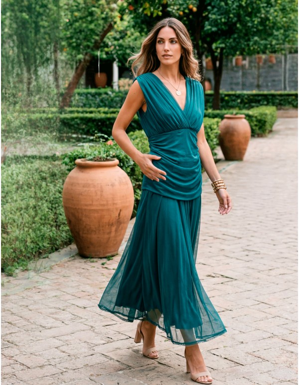 Petrol colored midi dress with halter neckline and flowing skirt 2