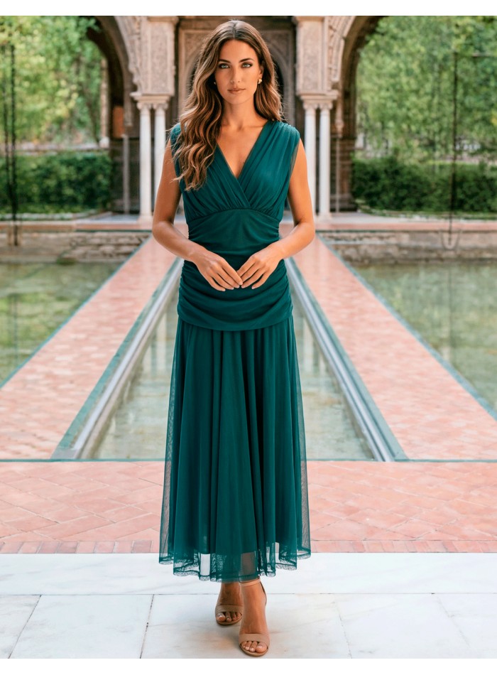 Petrol colored midi dress with halter neckline...