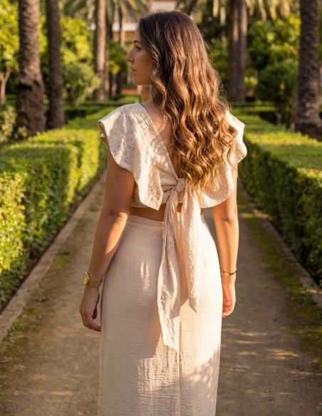 Beige two-piece set with lace top and midi skirt