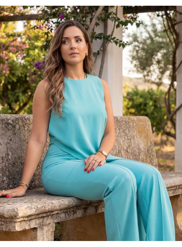 Turquoise jumpsuit with chiffon ruffle for guests