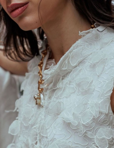 Off-white vest with floral embossing