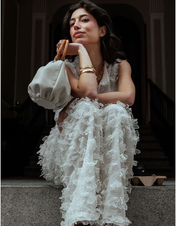 Off-white flowing pants with floral embossing 2