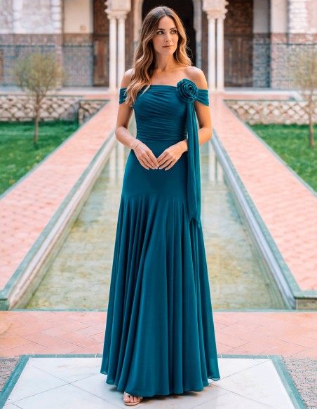 This long duck blue dress is the perfect choice for guests looking for a sophisticated, elegant and different look.