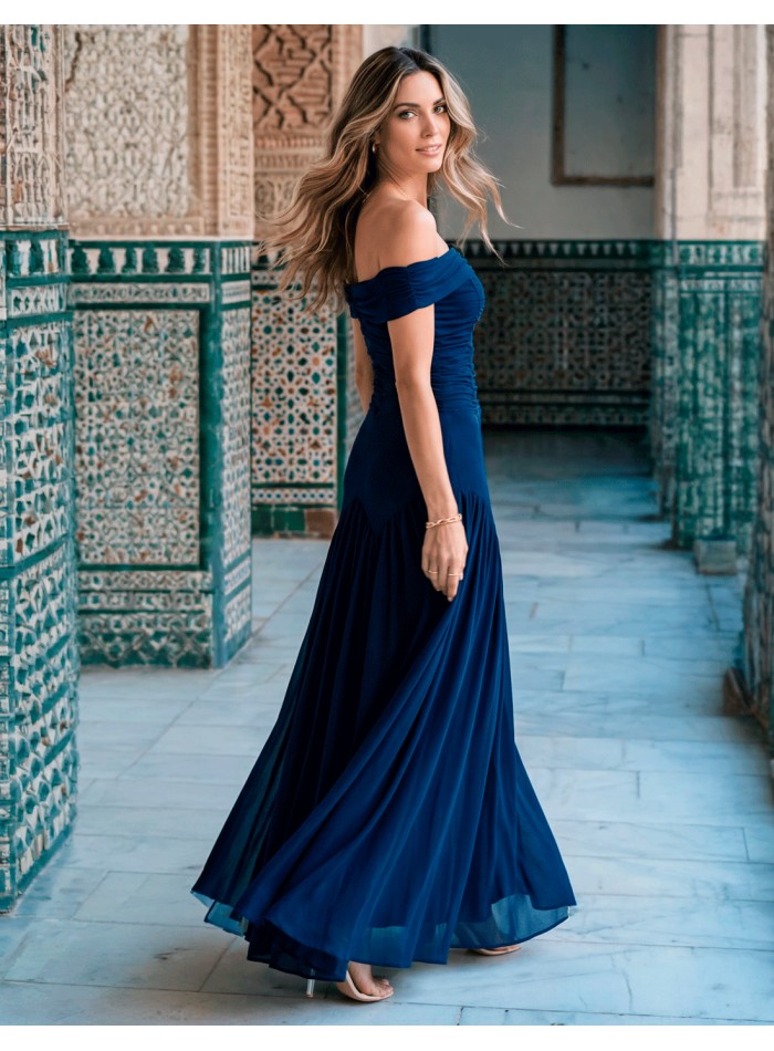 Long navy blue dress with draped flower for guest