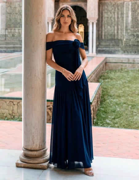 Long navy blue dress with draped flower for guest