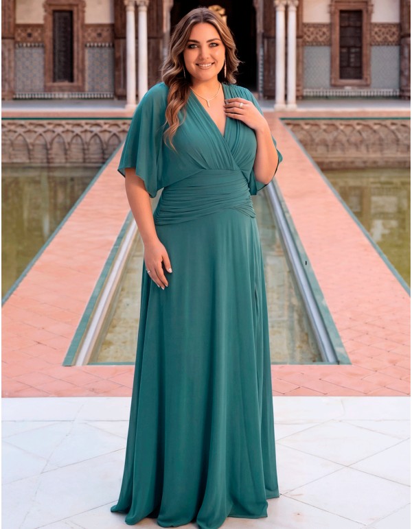 Sage green plus size dress with cape sleeve and slit for guests