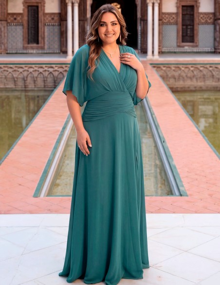 Sage green plus size dress with cape sleeve and slit for guests