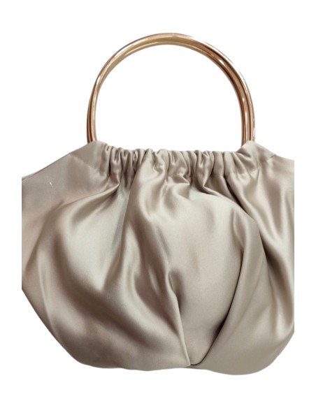Champagne-colored satin clutch with circular handles