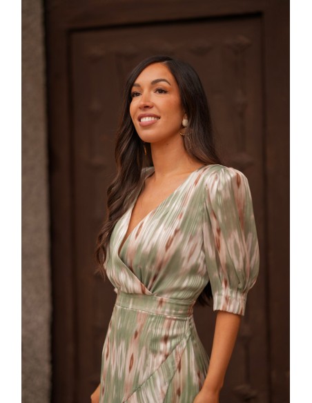 Midi dress for a wedding guest with a crossover neckline and a pastel-colored print