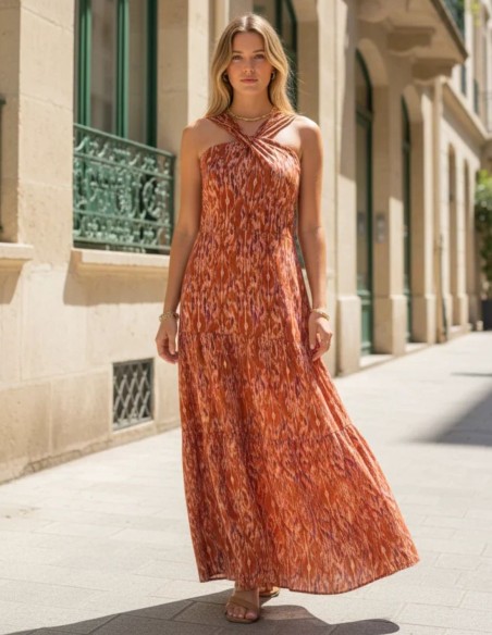 Long, earth-toned printed dress with a halter neckline