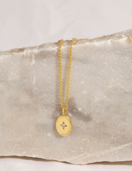 Gold pendant with a medallion adorned with a cubic zirconia star