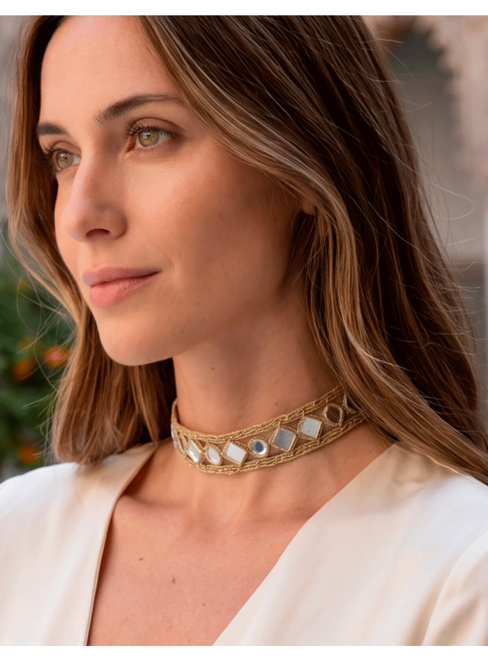 A delicate gold mirror choker with small diamond-shaped pieces. A delicate, elegant, and very versatile design for any occasion.