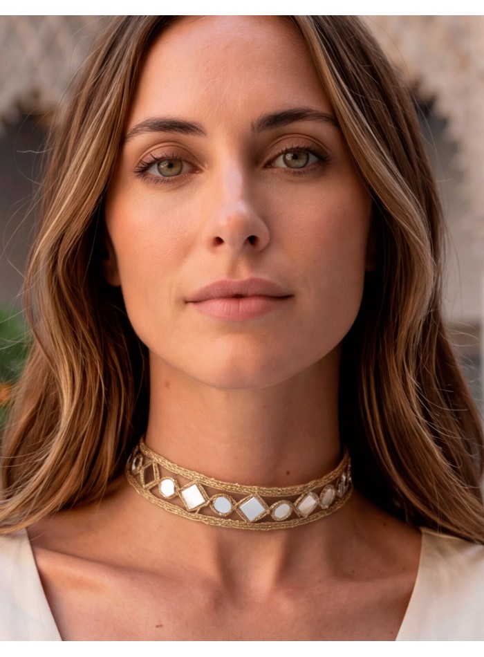 A delicate gold mirror choker with small diamond-shaped pieces. A delicate, elegant, and very versatile design for any occasion.
