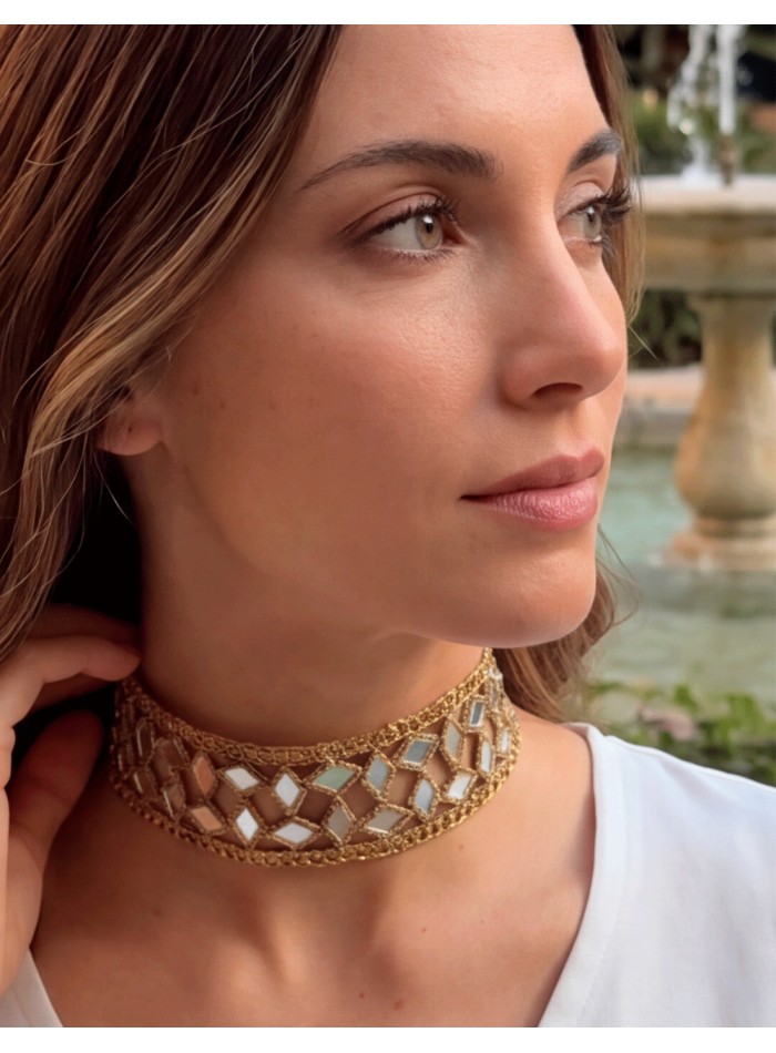 Handcrafted fabric choker with crystals and an adjustable design.