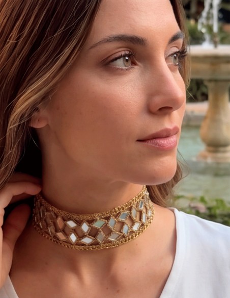 Handcrafted fabric choker with crystals and an adjustable design.