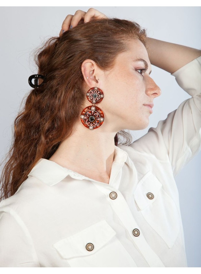 Orange earrings with circles and pearl and...