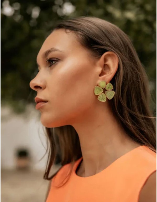Circular earrings with lime green stones in a geometric...