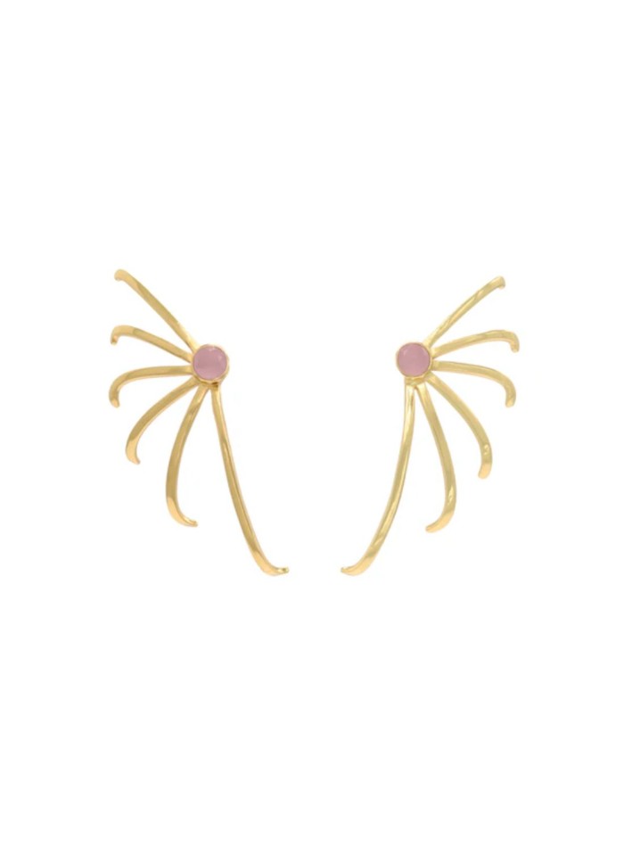 Gold earrings with lines radiating from a pink...
