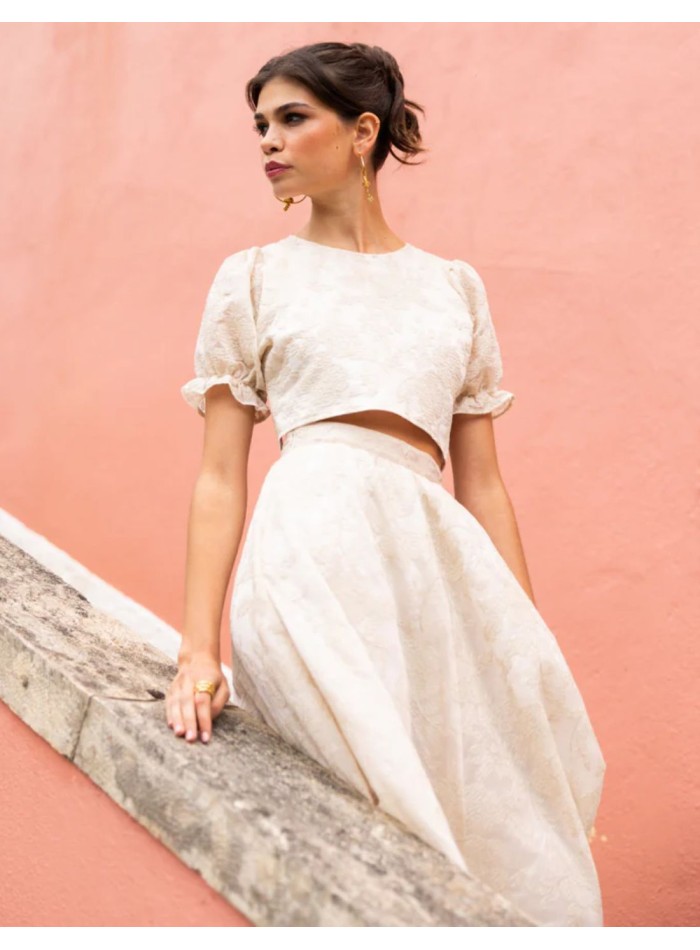 Ivory crop top with puffed sleeves and an open...
