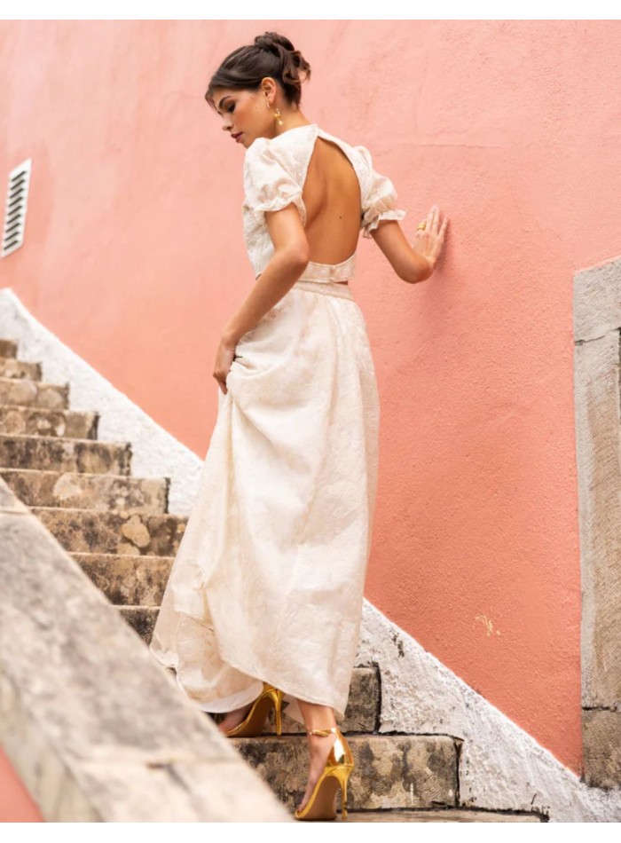 Ivory crop top with puffed sleeves and an open...