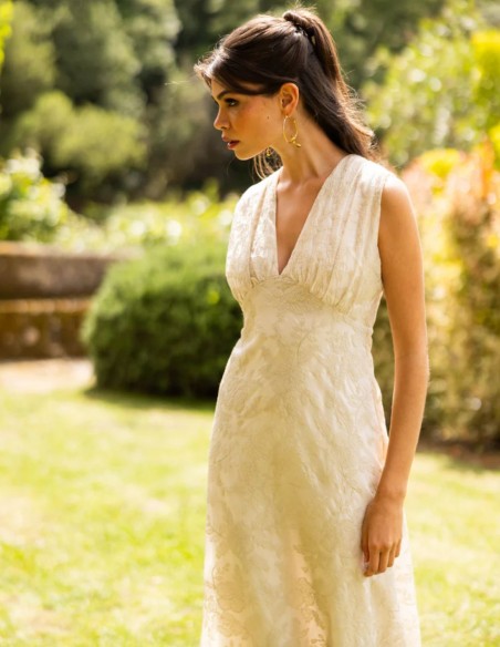 Ivory midi dress with embroidery and a V-neckline