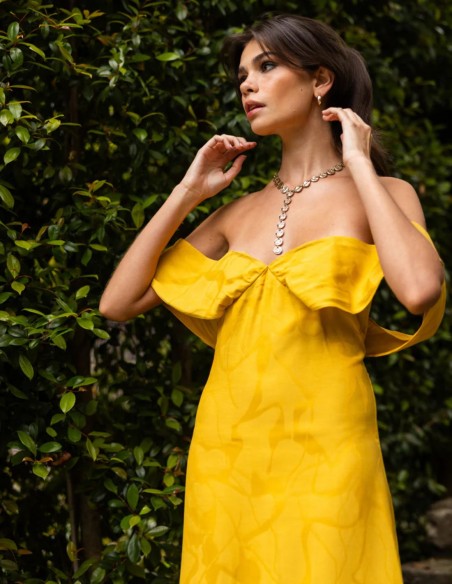 Long saffron-yellow dress with a subtle print and a Bardot neckline
