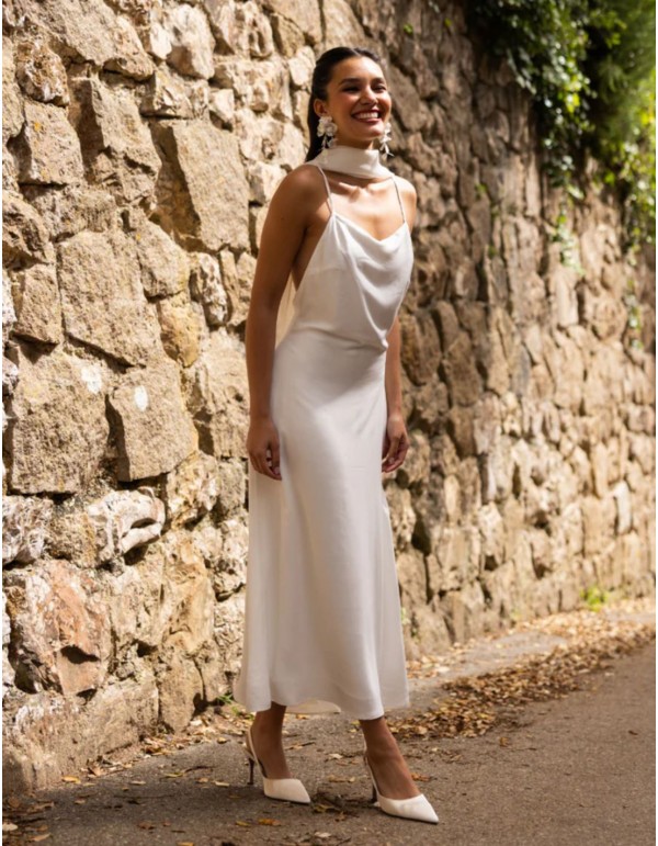 White lingerie-style dress with a draped neckline and... 2
