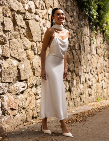 White lingerie-style dress with a draped neckline and open back