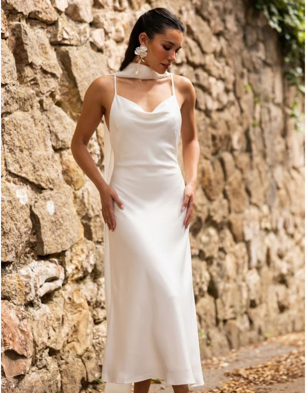 White lingerie-style dress with a draped neckline and...