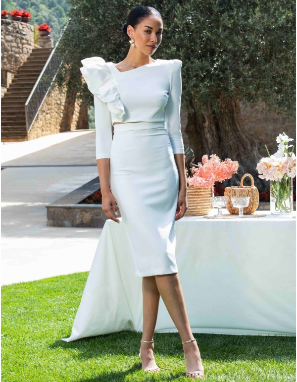 Party outfit with a long-sleeved top and pencil skirt