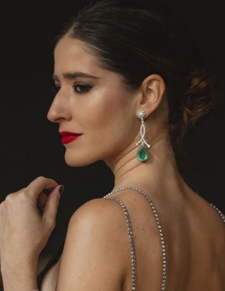 Silver earrings with a teardrop-shaped green stone