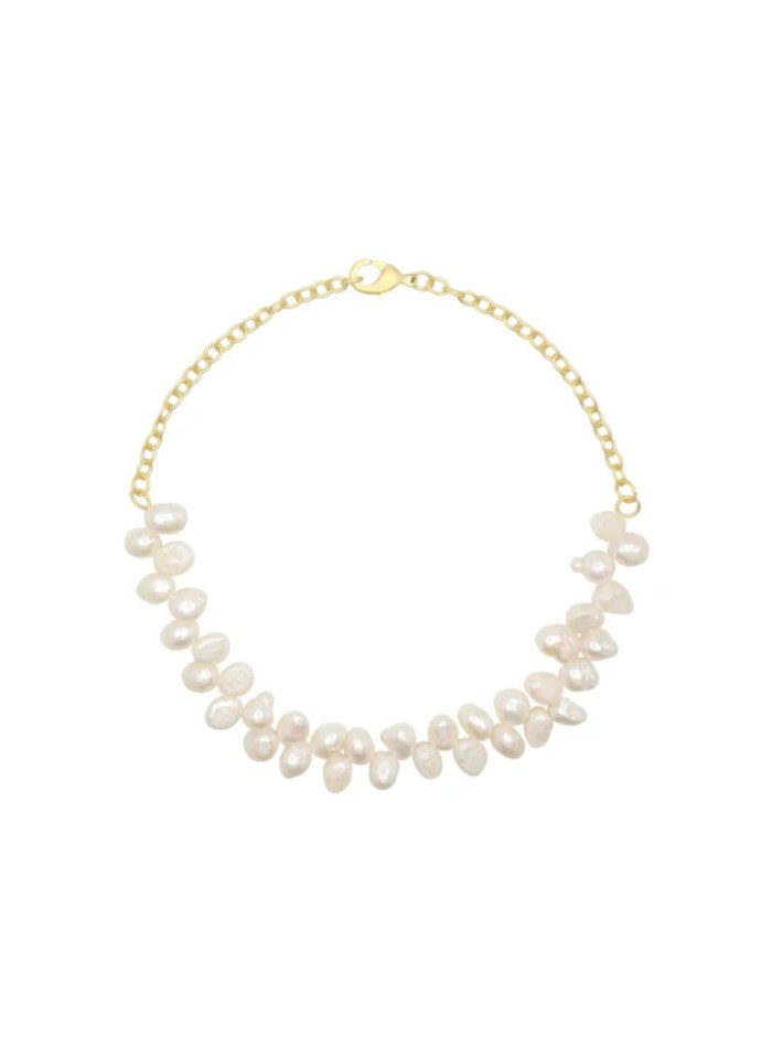 Collier ras-du-cou doré composé de perles de...