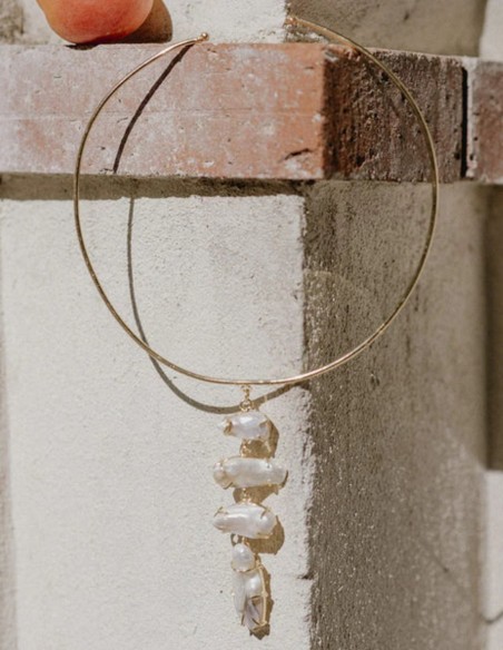 Handcrafted necklace with a central ring and dangling stones