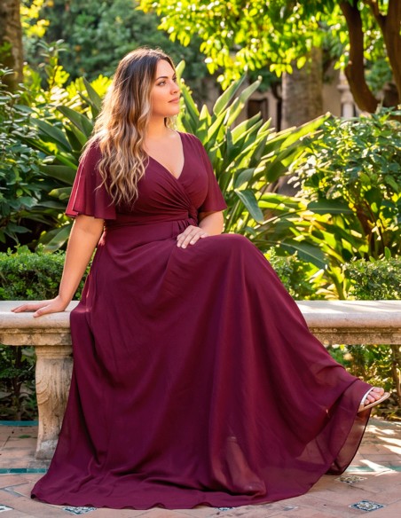 An elegant, flattering burgundy dress for curvy guests—a plus-size party dress
