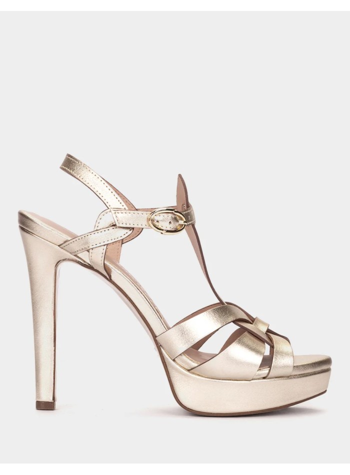 Platinum-colored party sandals with heels and a...