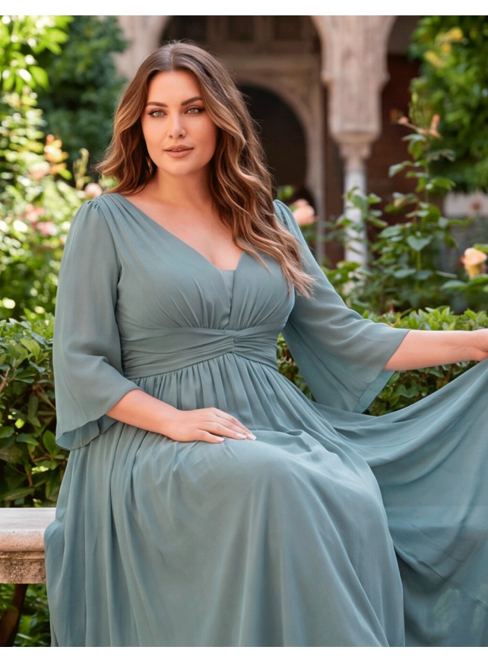 The smoke-blue dress in plus sizes is perfect for guests looking for elegance and comfort