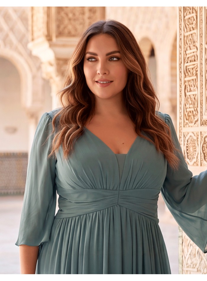 Long smoke-blue evening dress for plus sizes with a V-neckline, chiffon three-quarter sleeves, and a draped waist.