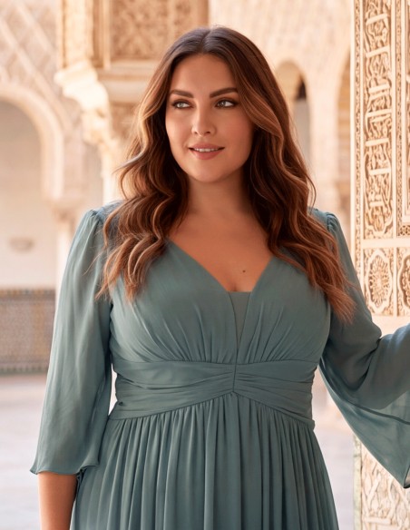 Long smoke-blue evening dress for plus sizes with a V-neckline, chiffon three-quarter sleeves, and a draped waist.