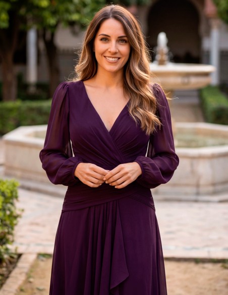 Long plum-colored evening gown with a crossover V-neckline, long chiffon sleeves, a draped waist, and a flowing skirt