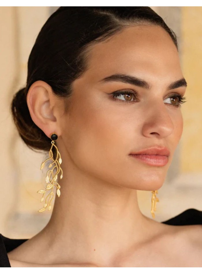 Gold earrings with a black stone and branches