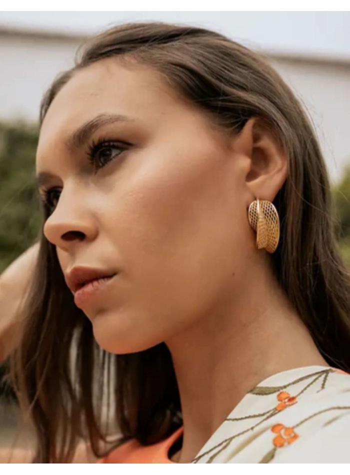 Large, curved gold hoops with a lattice design