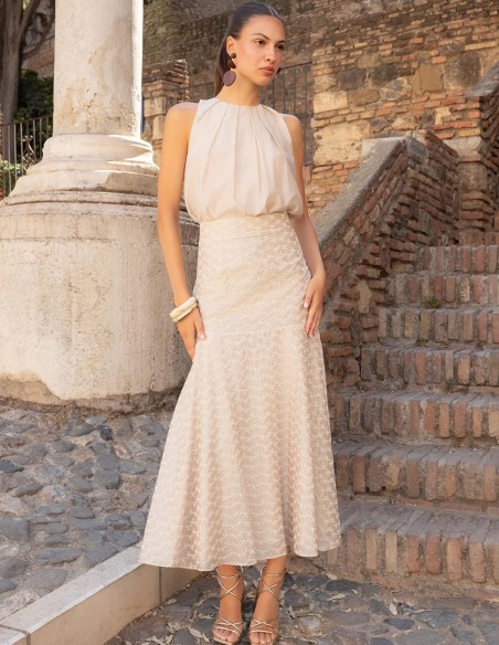 Short, pleated blouse for a wedding guest