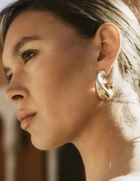 Large gold hoops with an irregular design