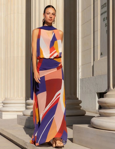 Long printed chiffon dress with a crossover neckline and a flared skirt