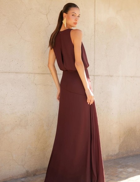 Long brown dress with a crossover neckline and a draped bodice