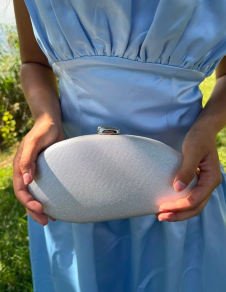 Oval silver clutch with a glossy finish