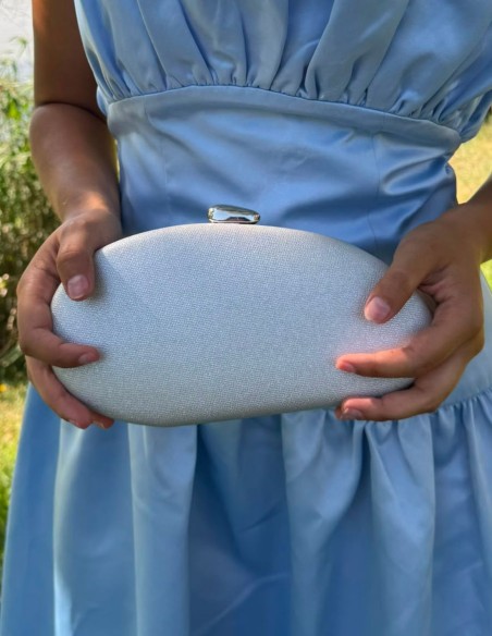 Oval silver clutch with a glossy finish